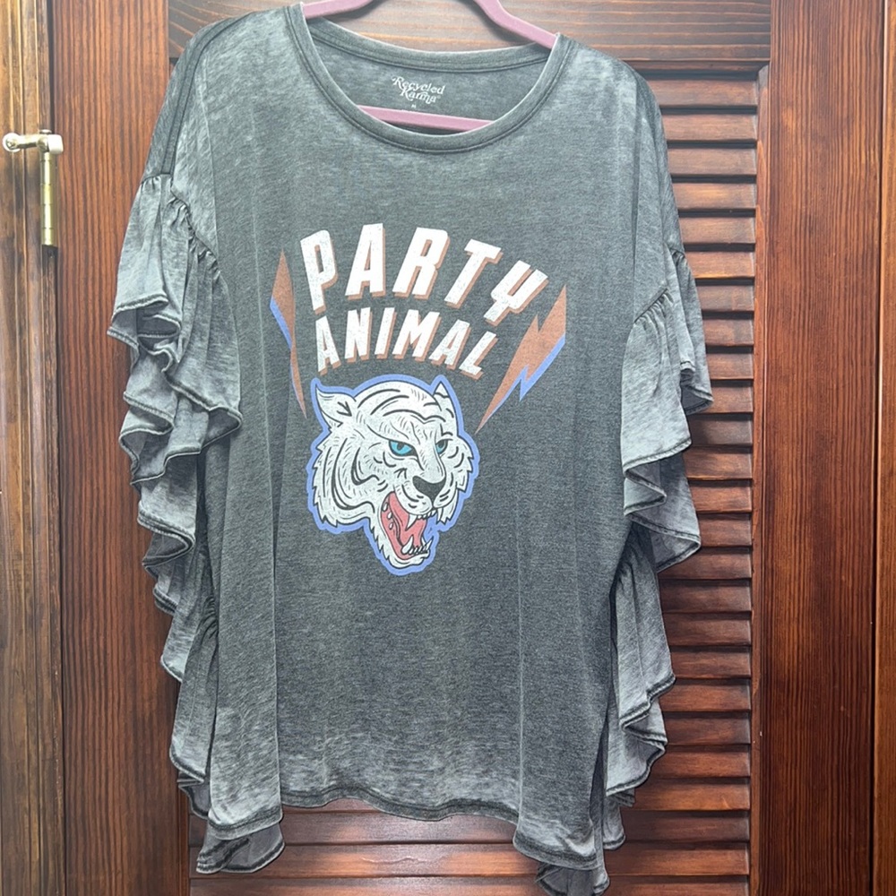 Brand new with tags removed - never worn! Graphic tee with ruffle detail!